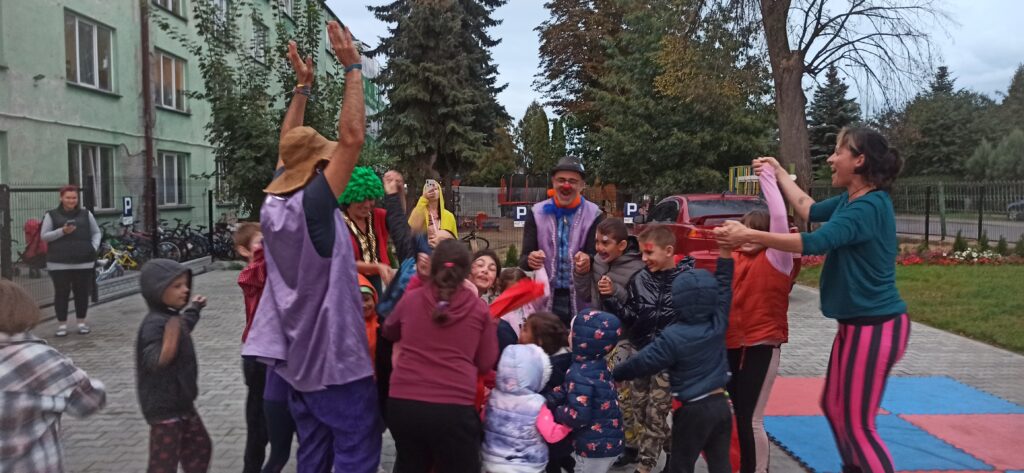 group of circus artists jumping with kids