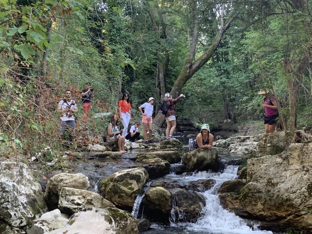 Participants in the nature , enjoying waterfalls.